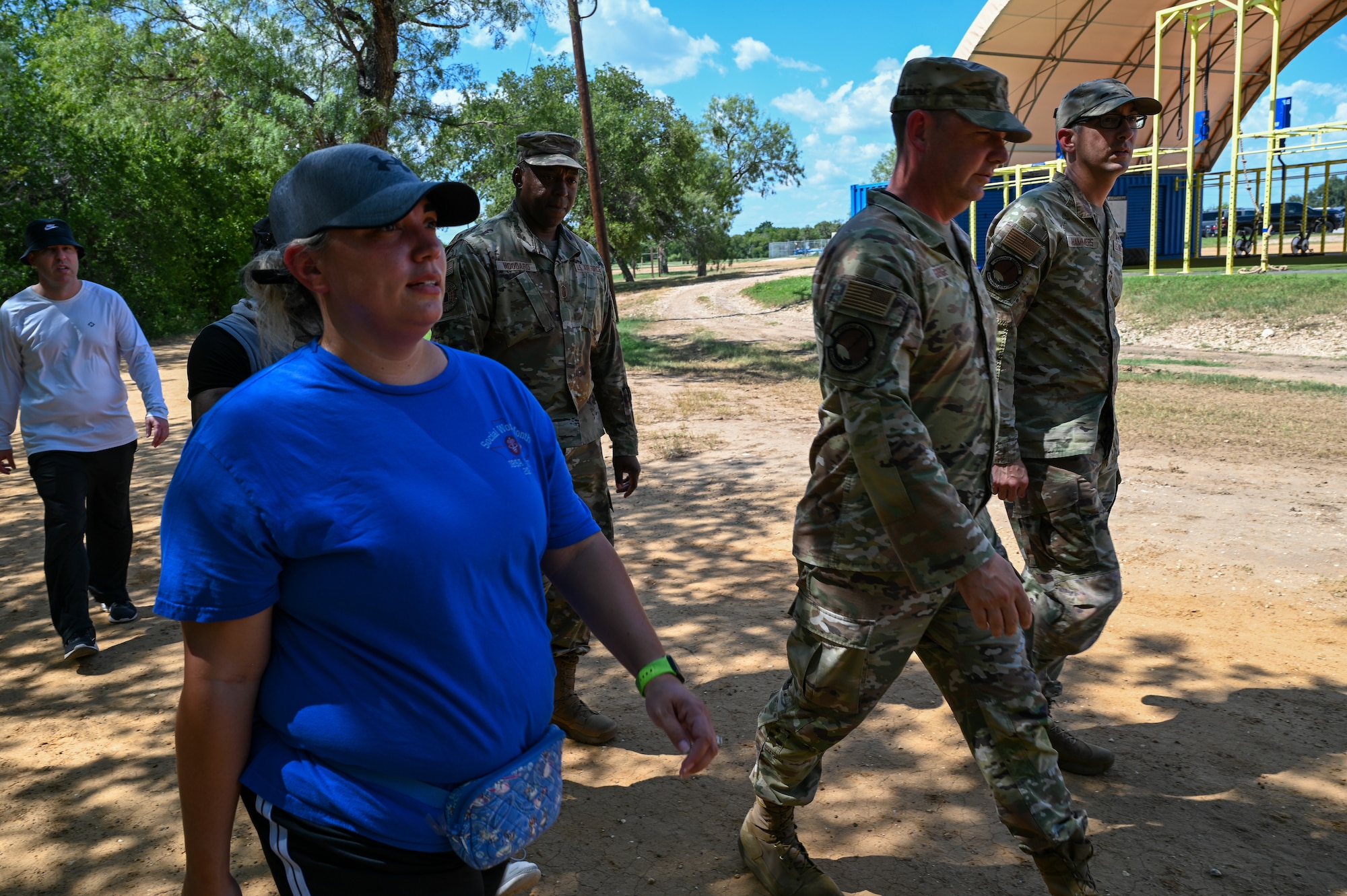 Frances Martinez, center left, 960th CW director of psychological health, walks alongside Airmen at a 5K run at the Medina Chapman Fitness Center on Joint Base San Antonio-Lackland, Texas Sep. 2, 2025.
