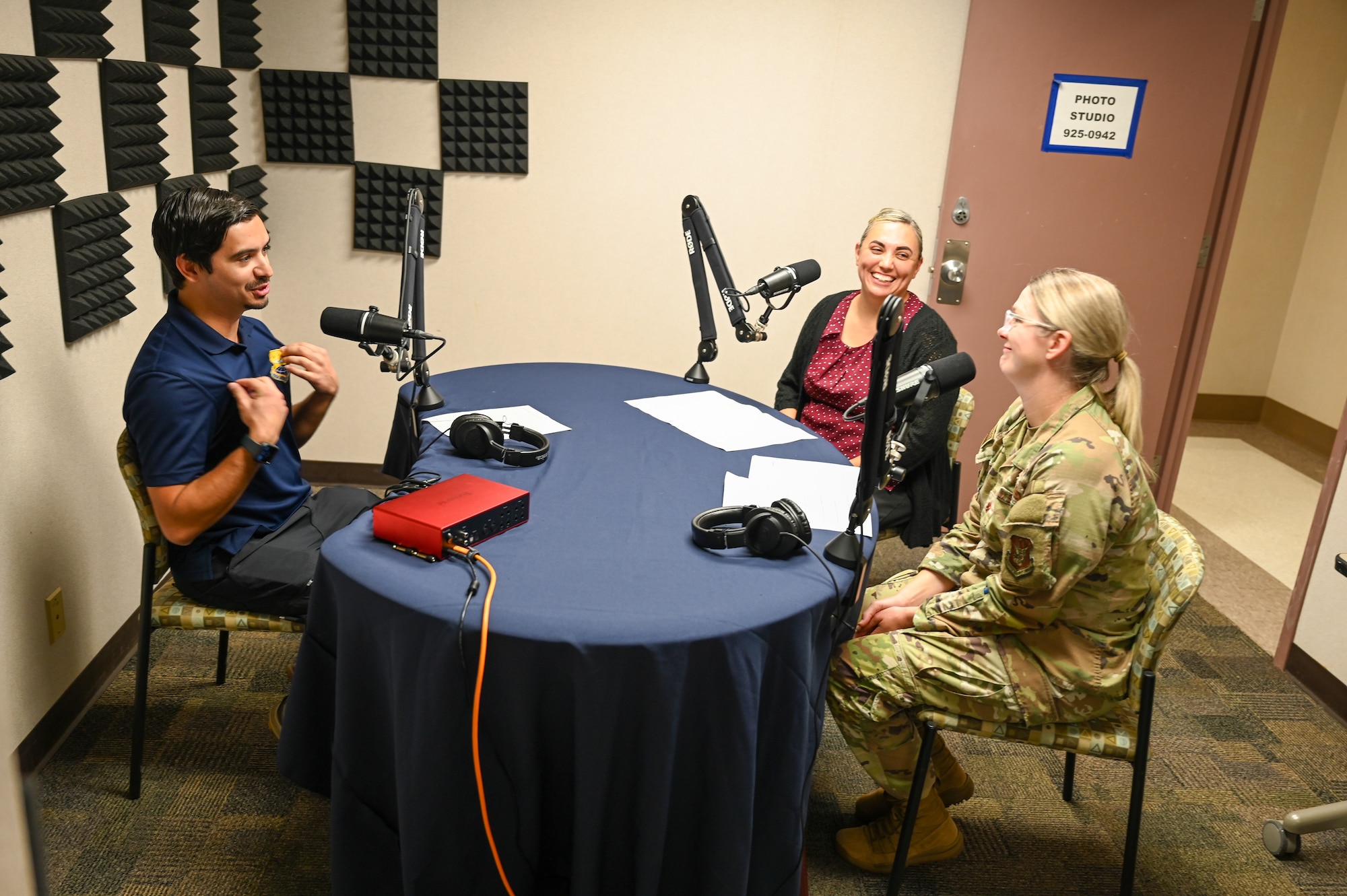 Frances Martinez, center, 960th Cyberspace Wing director of psychological health, Chaplain (Maj.) Heather Mendoza, 433rd Airlift Wing deputy wing chaplain, and Julian Hernandez, 433rd Airlift Wing public affairs specialist, discuss suicide awareness during an episode of the “Ready, Set, Airlift!” podcast at Joint Base San Antonio-Lackland, Texas Sep. 3, 2025.