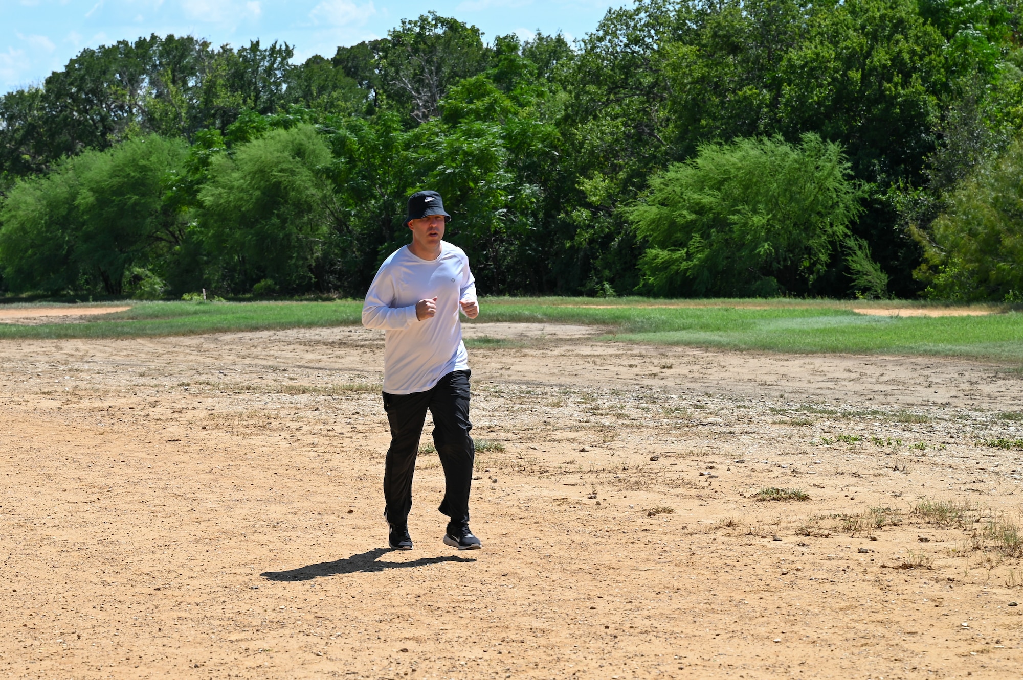 Col. Joshua Garrison, 960th Cyberspace Wing commander, participates in a 40,000-mile challenge during a run at the Medina Chapman Fitness Center on Joint Base San Antonio-Lackland, Texas, Sept. 2, 2025.
