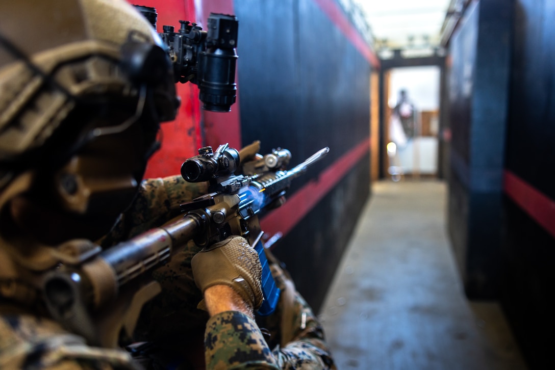 A U.S. Marine with Battalion Landing Team 3/5, 11th Marine Expeditionary Unit, engages simulated targets during a close-quarters tactics drill as part of Raid Leaders Course 24-5 hosted by Expeditionary Operations Training Group, I Marine Expeditionary Force, on Marine Corps Base Camp Pendleton, California, Sept. 4, 2025.