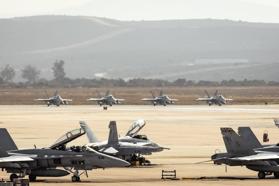 U.S. Marine Corps F/A-18 C/D Hornets assigned to Marine Fighter Attack Squadron (VMFA) 232, Marine Aircraft Group 11, 3rd Marine Aircraft Wing, prepare to take off for a trans-Pacific flight in support of the Unit Deployment Program at Marine Corps Air Station Miramar, California, Sept. 5, 2025.