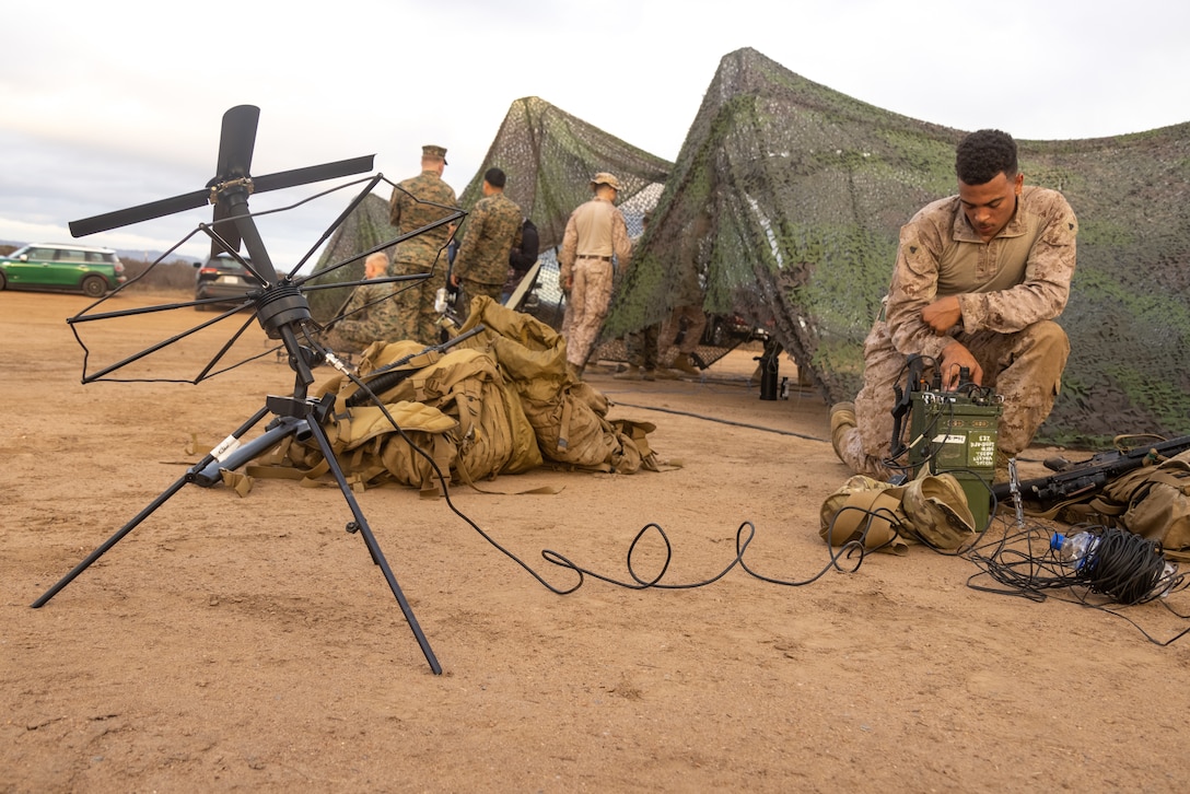 U.S. Marine Corps Cpl. John Burkheimer, a transmission systems operator with 11th Marine Regiment, 1st Marine Division, conducts a radio call during the inaugural Thunderstruck Communications Competition hosted by Marine Wing Communications Squadron 38, Marine Air Control Group 38, 3rd Marine Aircraft Wing, at Marine Corps Air Station Miramar, California, Sept. 10, 2025.