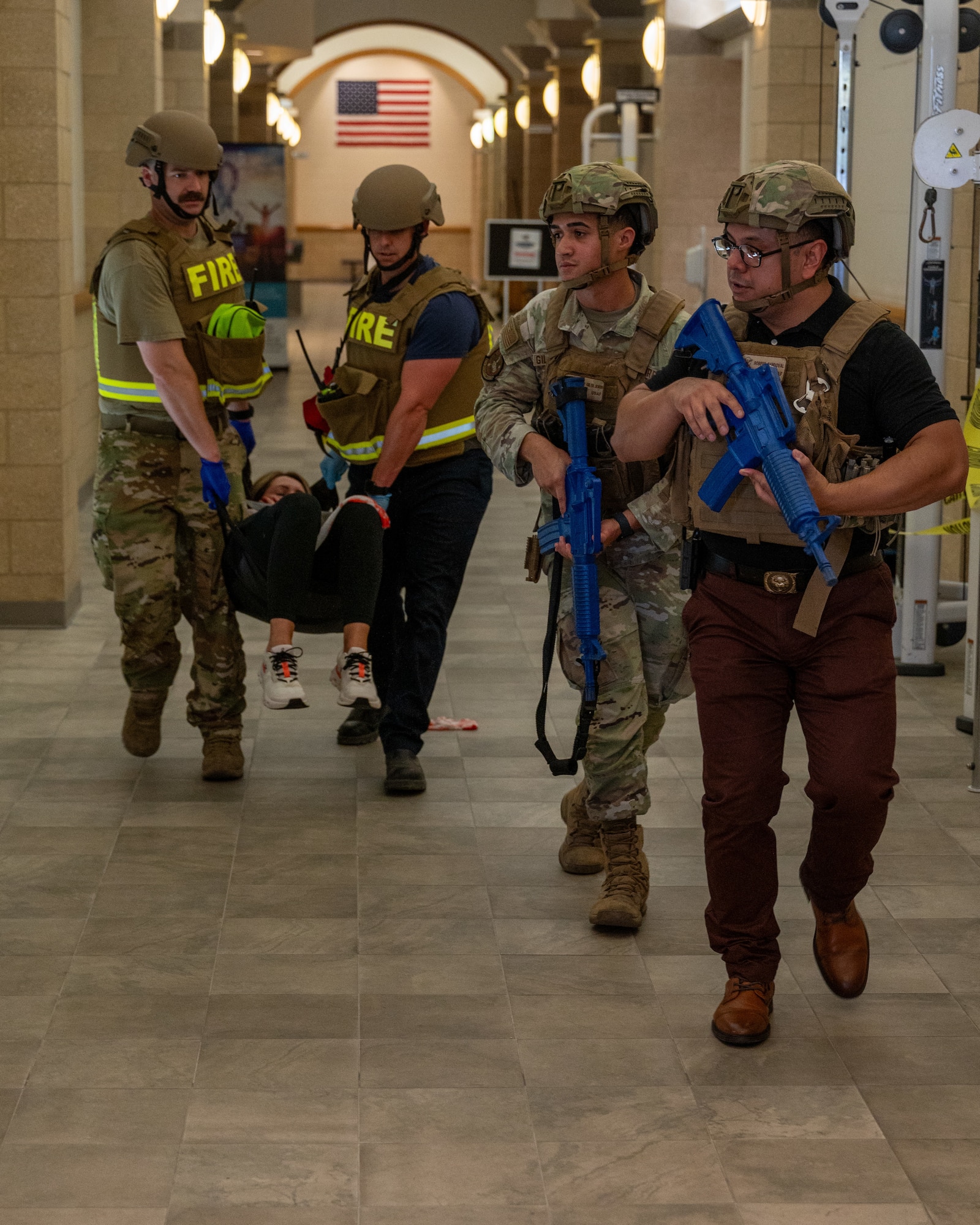 aughlin Air Force Base Security Forces Squadron (SFS) and fire personnel transport a wounded hostage out of the building during an exercise at Laughlin Air Force Base, Texas, Sept. 4, 2025. The exercise tested SFS and medical personnel’s response to hostage situations and active shooters. (U.S. Air Force photo by Staff Sgt. Nicholas Larsen)