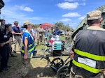 Image of Members of the 15th Medical Group practice the transfer of patients during Exercise Ultimate Caduceus 25 at Joint Base Pearl Harbor-Hickam, Hawaii, on July 24, 2025. Ultimate Caduceus is an annual U.S. Transportation Command exercise that tests the Defense Department's ability to coordinate large-scale military patient movement from the Indo-Pacific region to medical facilities within the United States.