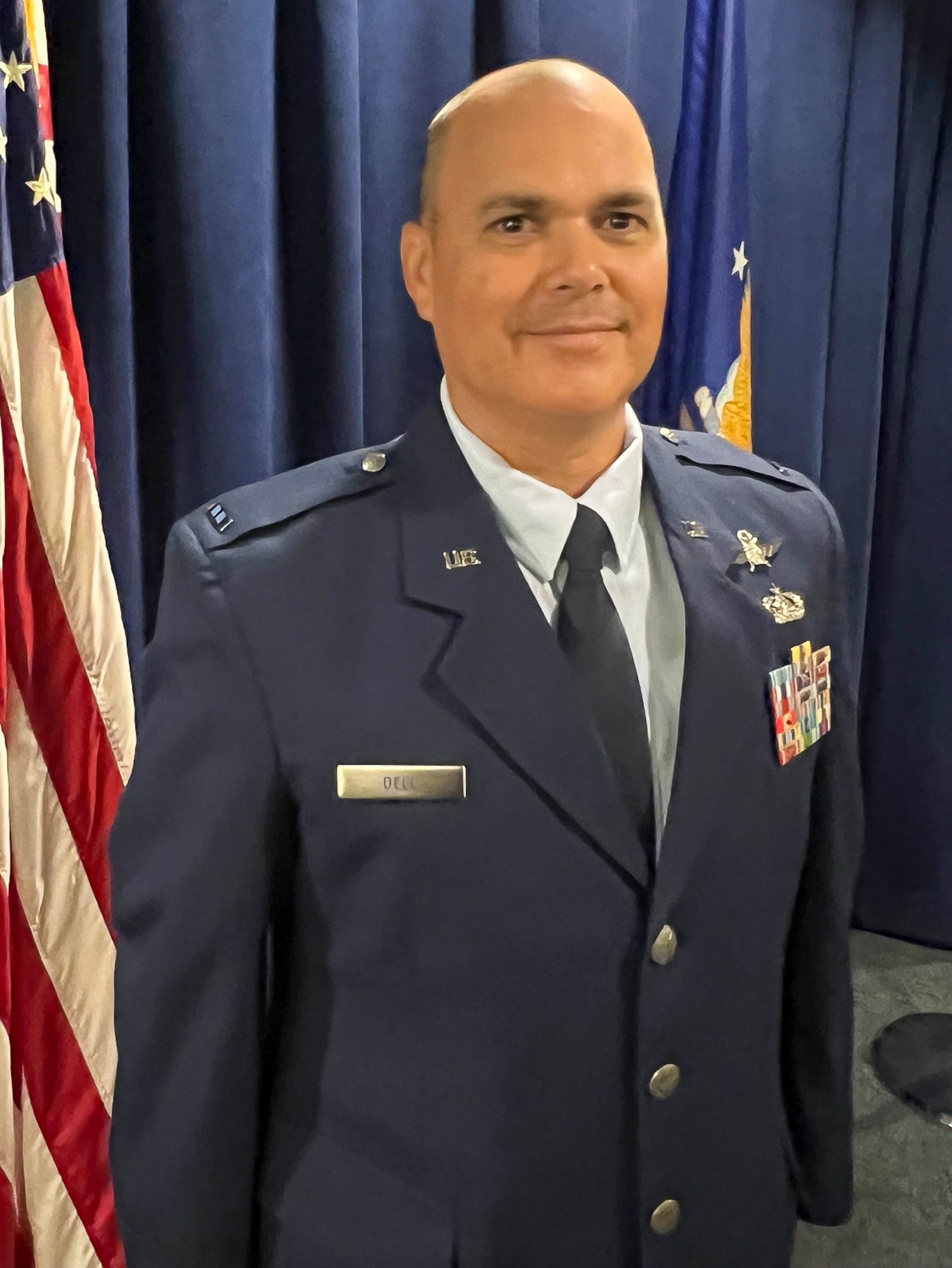 CWO2 Dell stands and smiles