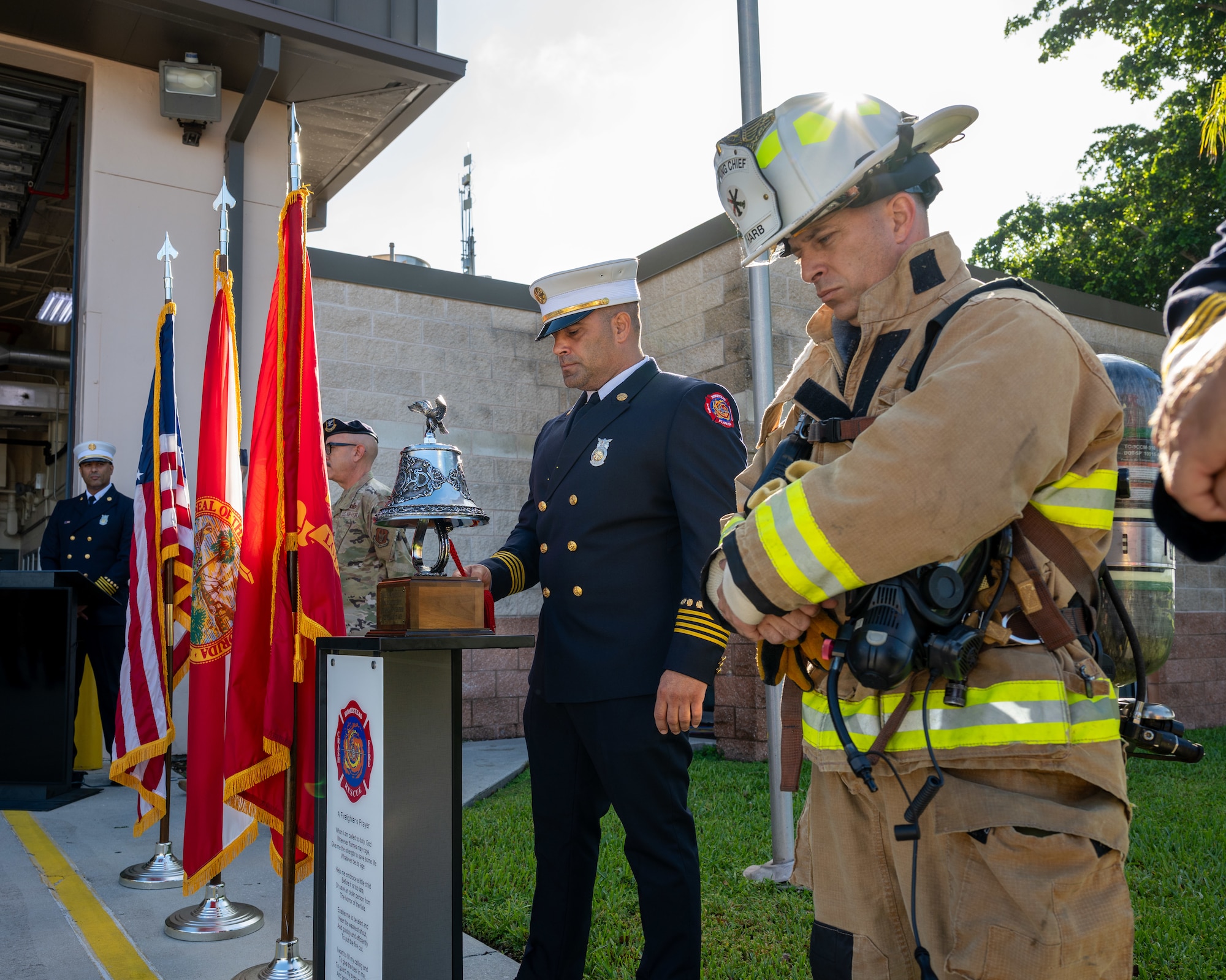 Homestead firefighters pause during a ceremony honoring all those who lost their lives on Sept. 11, 2001, including the 343 firefighters who died while selflessly working to save others, at Homestead Air Reserve Base, Florida, Sept. 11, 2025. In attendance were firefighters, military members, civilians, and dependents, who later joined in a memorial walk. (U.S. Air Force photo by Master Sgt. Lionel Castellano)