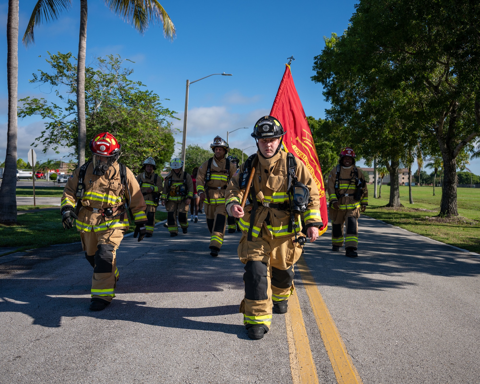 Firefighters lead a memorial walk during a 9/11 tribute event at Homestead Air Reserve Base, Florida, Sept. 11, 2025.
