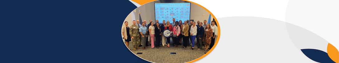 A group of in-person and digital attendees from Defense Contract Management Agency’s Organizational Infrastructure Capability Board pose for a photo during the second day of their 2025 summit.