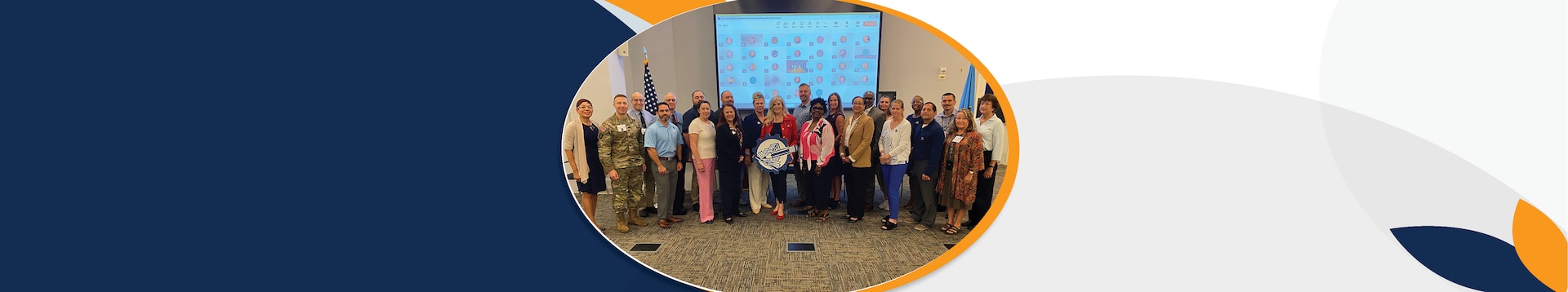 A group of in-person and digital attendees from Defense Contract Management Agency’s Organizational Infrastructure Capability Board pose for a photo during the second day of their 2025 summit.
