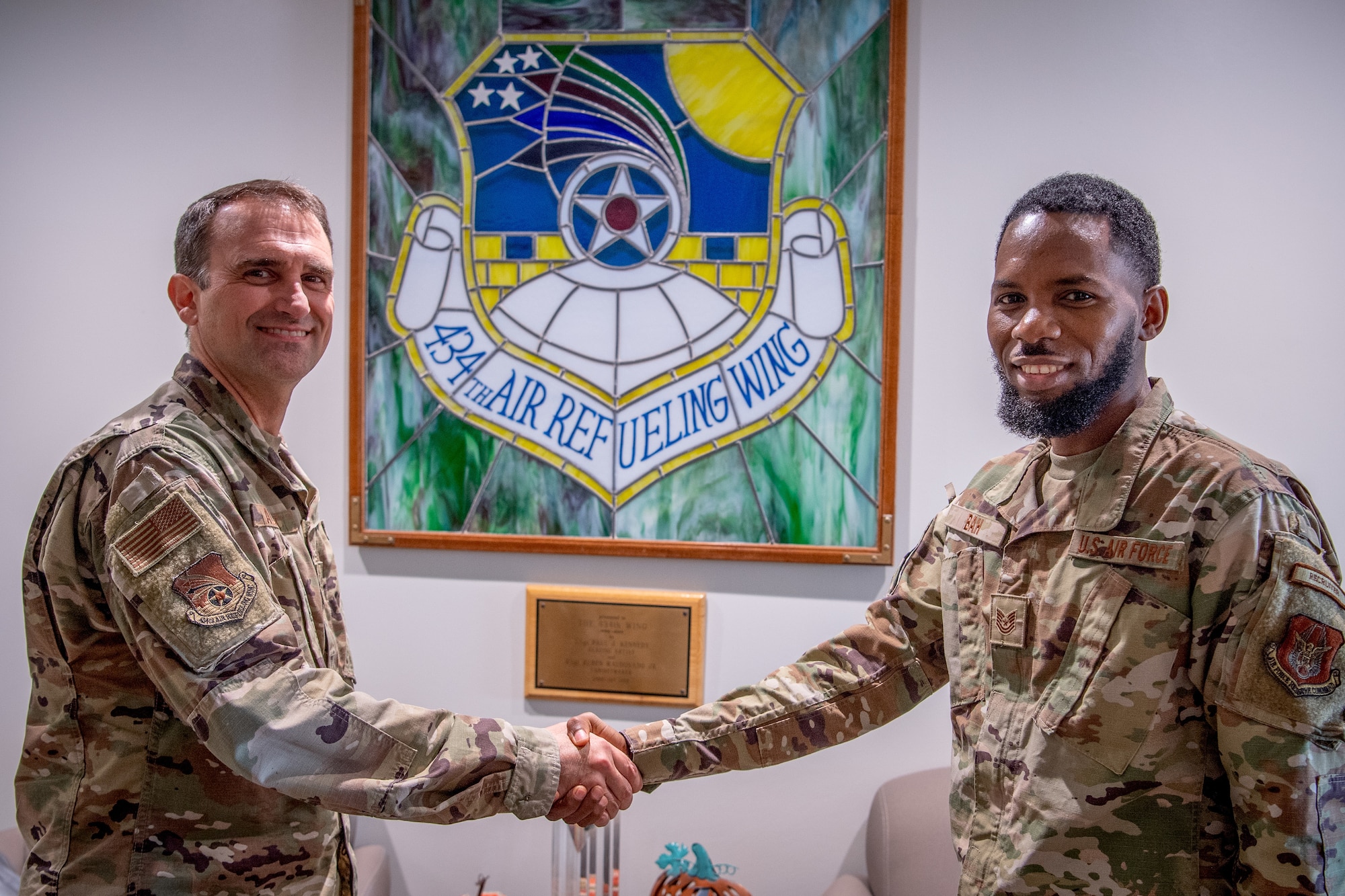 Col. Michael S. Albert, 434th Air Refueling Wing commander, Grissom Air Reserve Base, Indiana, coins Tech. Sgt. Abdoulie Bah, Team Grissom recruiter, 350th Recruiting Squadron, for breaking a recruiting record by reaching 100 accessions within the 2025 fiscal year, becoming a ’Centurian Club’ recruiter August 9, 2025. The last time a recruiter accessed 100 or more new Airmen was in 2014 and there have been fewer than 10 to earn the distinction within the past 20 years. (U.S. Air Force photo by Master Sgt. Benjamin Mota)