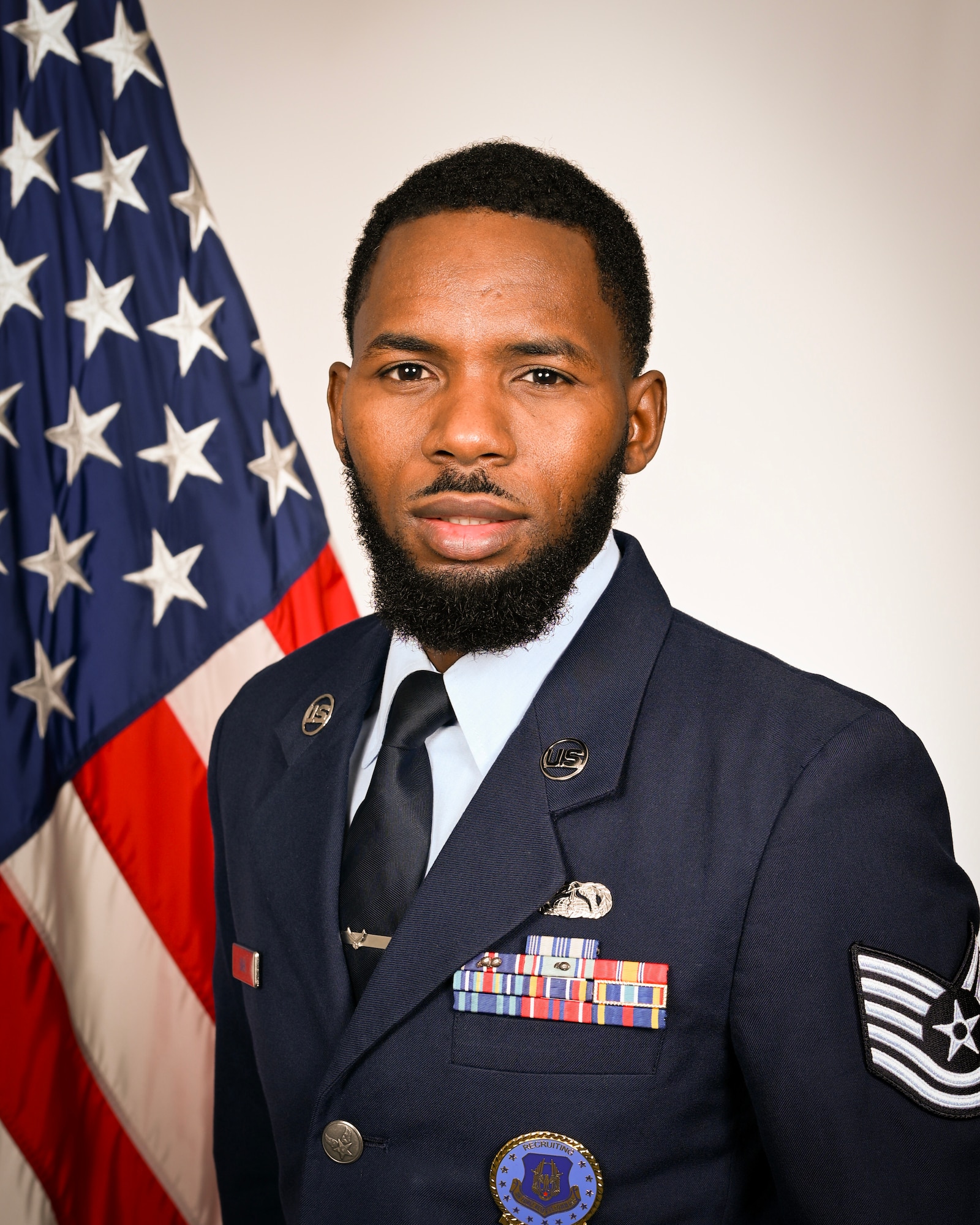 U.S. Air Force Tech. Sgt. Abdoulie Bah, 350th Recruiting Squadron recruiter, poses for an Air Force bio photo on Aug. 9, 2025, Grissom Air Reserve Base, Indiana. Bah recently broke a recruiting record with 100 accessions within the 2025 fiscal year, becoming a 'Centurian Club' recruiter. The last time a recruiter accessed 100 or more new Airmen was in 2014, there have been fewer than 10 to earn the distinction within the past 20 years. (U.S. Air Force photo by Master Sgt. Benjamin Mota)