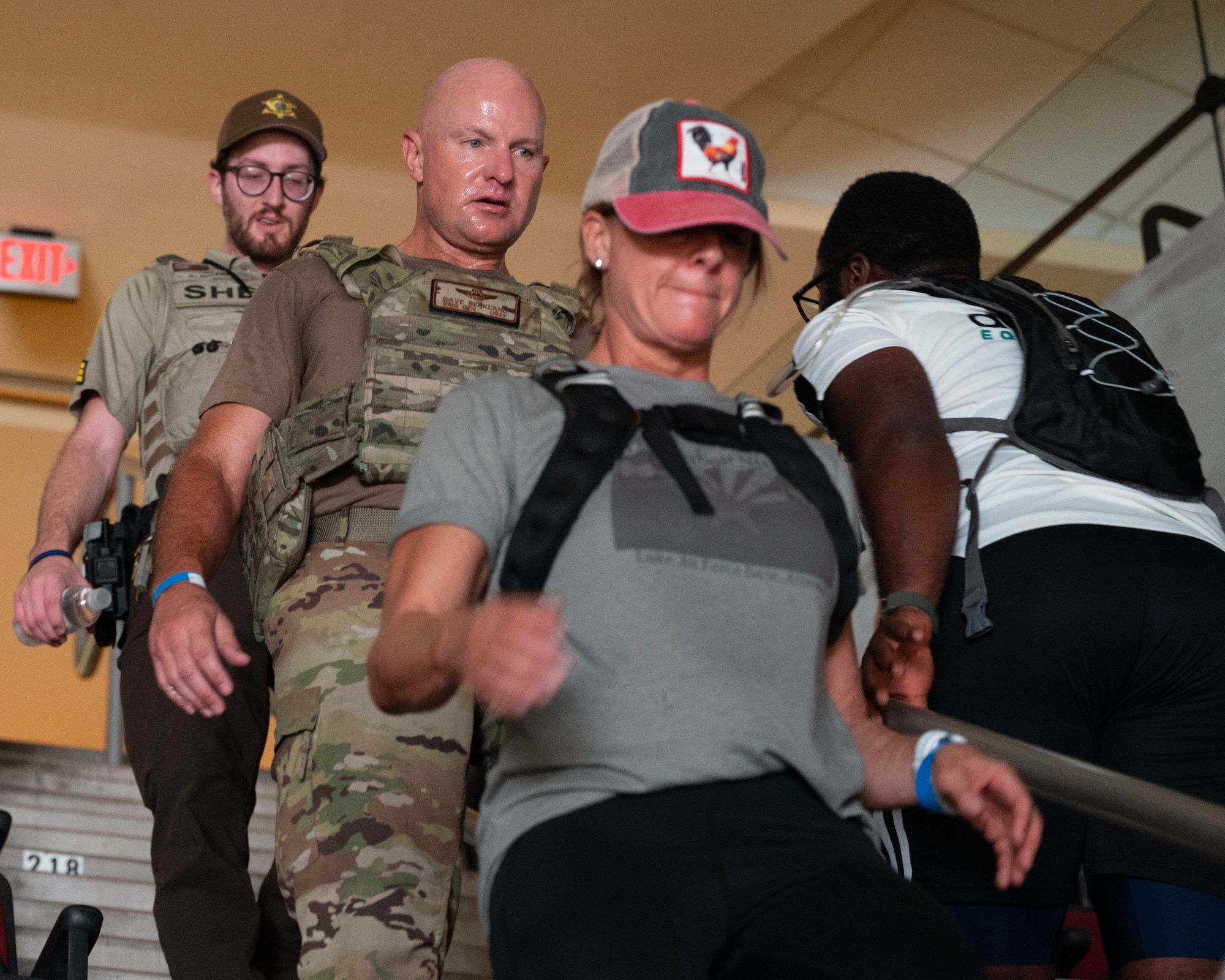 U.S. Air Force Brig. Gen. David Berkland, 56th Fighter Wing commander, descends stairs while participating in the 2025 Tower Challenge at Desert Diamond Arena, Glendale, Arizona, Sept. 6, 2025.