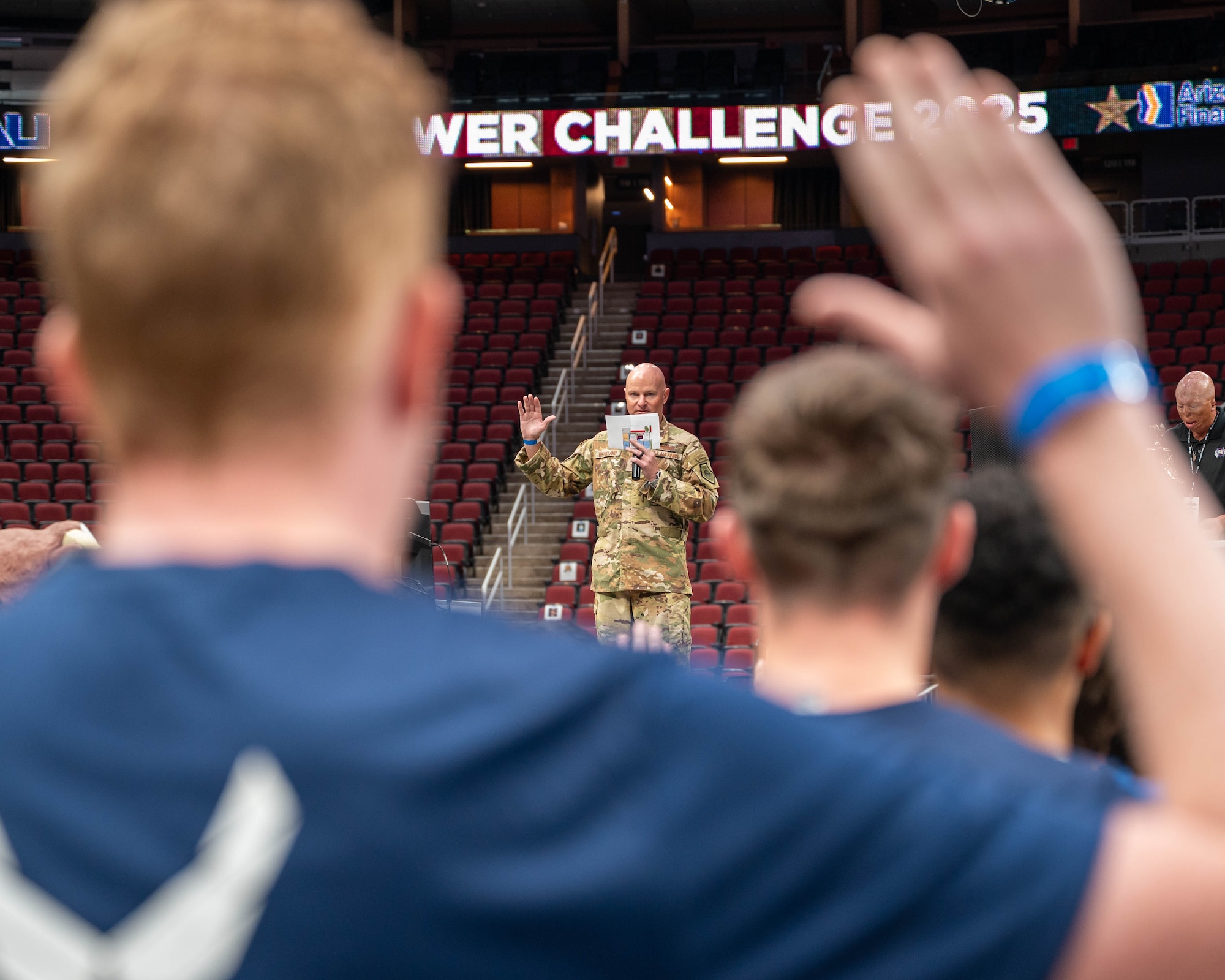 U.S. Air Force Brig. Gen. David Berkland, 56th Fighter Wing commander, swears in new U.S. Air Force and Space Force recruits at the 2025 Tower Challenge at Desert Diamond Arena, Glendale, Arizona, Sept. 6, 2025.