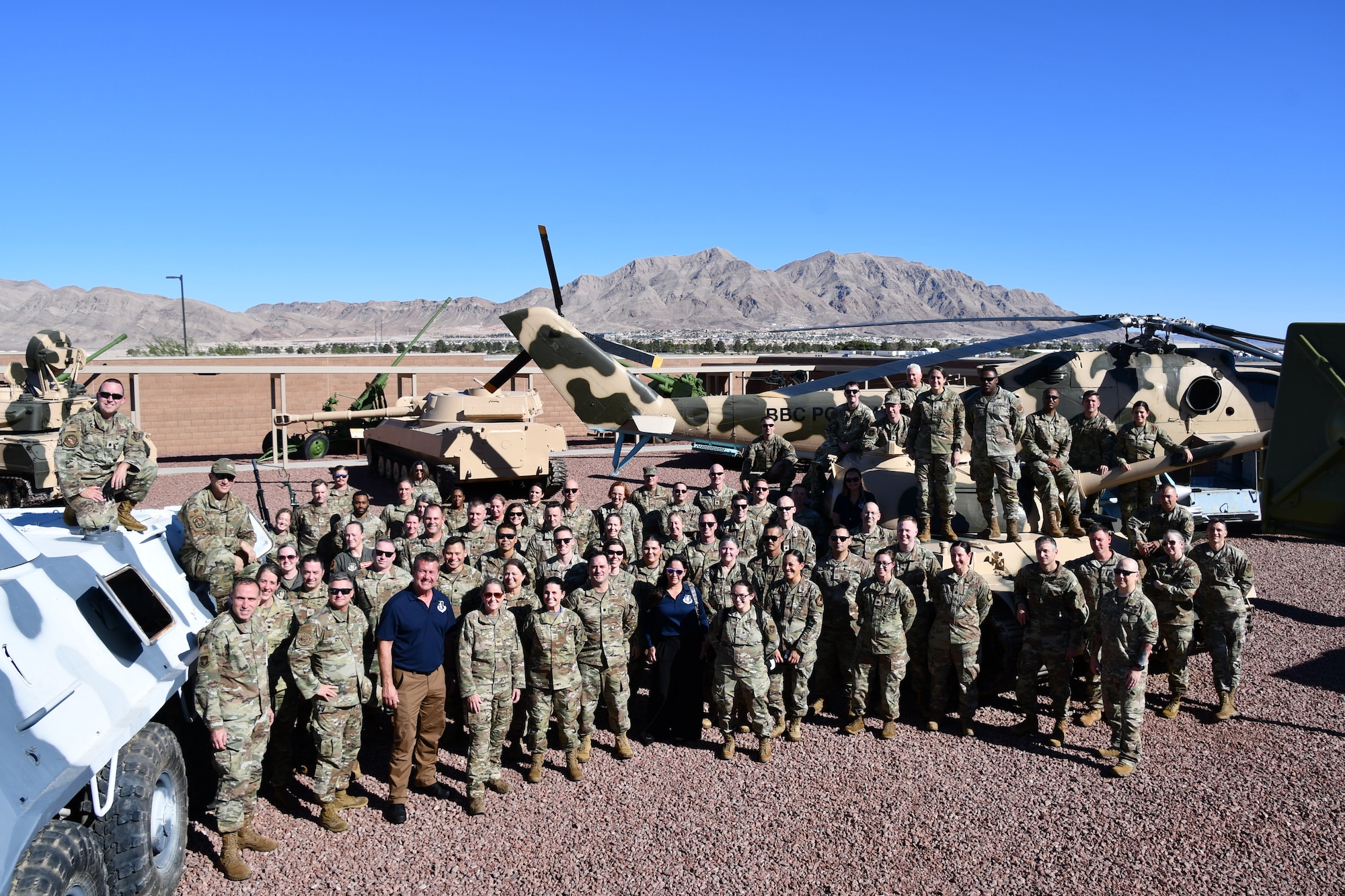 Members of the 655th Intelligence, Surveillance and Reconnaissance Wing pose outside the Threat Training Facility at Nellis Air Force Base, Nevada, Sept. 9, 2025. The wing gathered for its Annual Leadership Event, bringing all 14 geographically separated squadrons together to discuss and plan for the ISR enterprise. (U.S. Air Force photo by Maj. Wilson Wise)