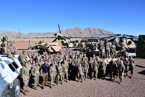Members of the 655th Intelligence, Surveillance and Reconnaissance Wing pose outside the Threat Training Facility at Nellis Air Force Base, Nevada, Sept. 9, 2025. The wing gathered for its Annual Leadership Event, bringing all 14 geographically separated squadrons together to discuss and plan for the ISR enterprise. (U.S. Air Force photo by Maj. Wilson Wise)