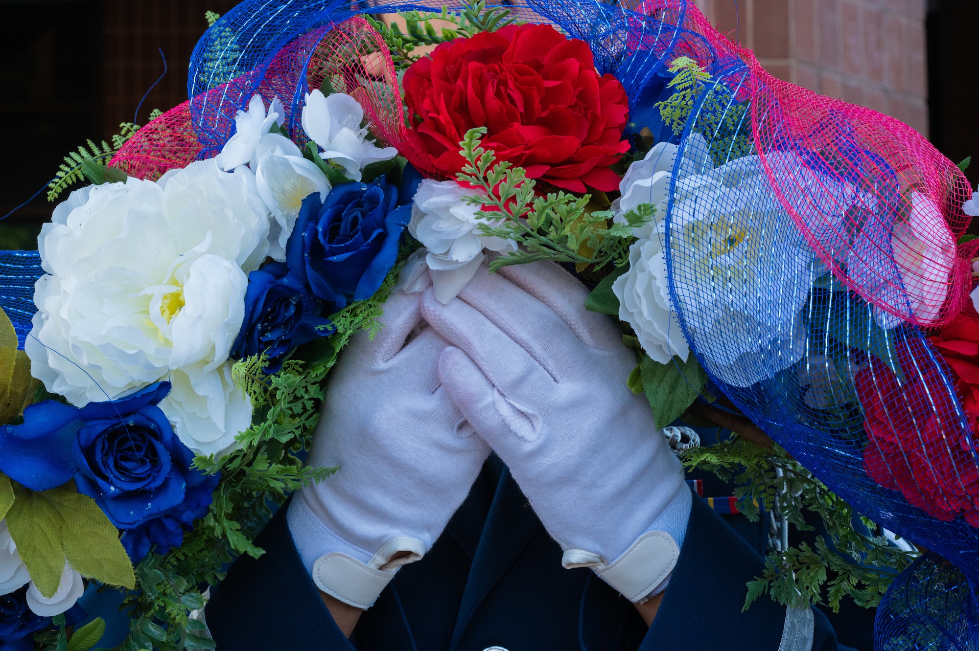 A base honor guardsman assigned to the 509th Force Support Squadron holds a wreath during a 9/11 remembrance ceremony at Whiteman Air Force Base, Missouri, Sept. 11, 2025. The wreath was laid in memory of those who lost their lives during the attack on Sept. 11, 2001. (U.S. Air Force photo by Senior Airman Joseph Garcia)
