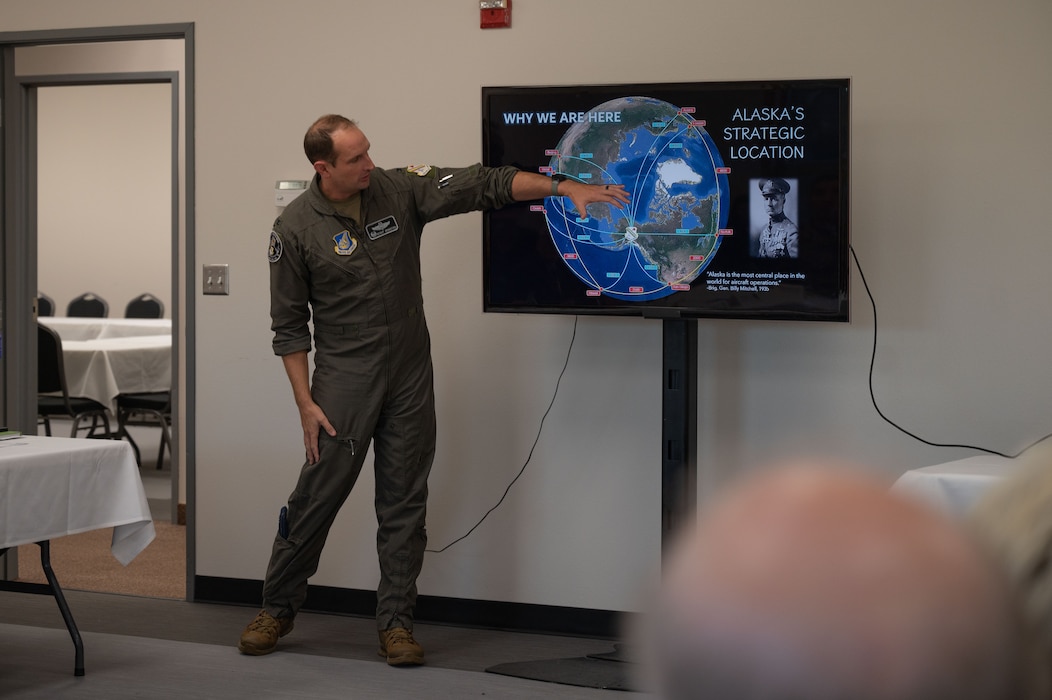Colonel points at map on screen