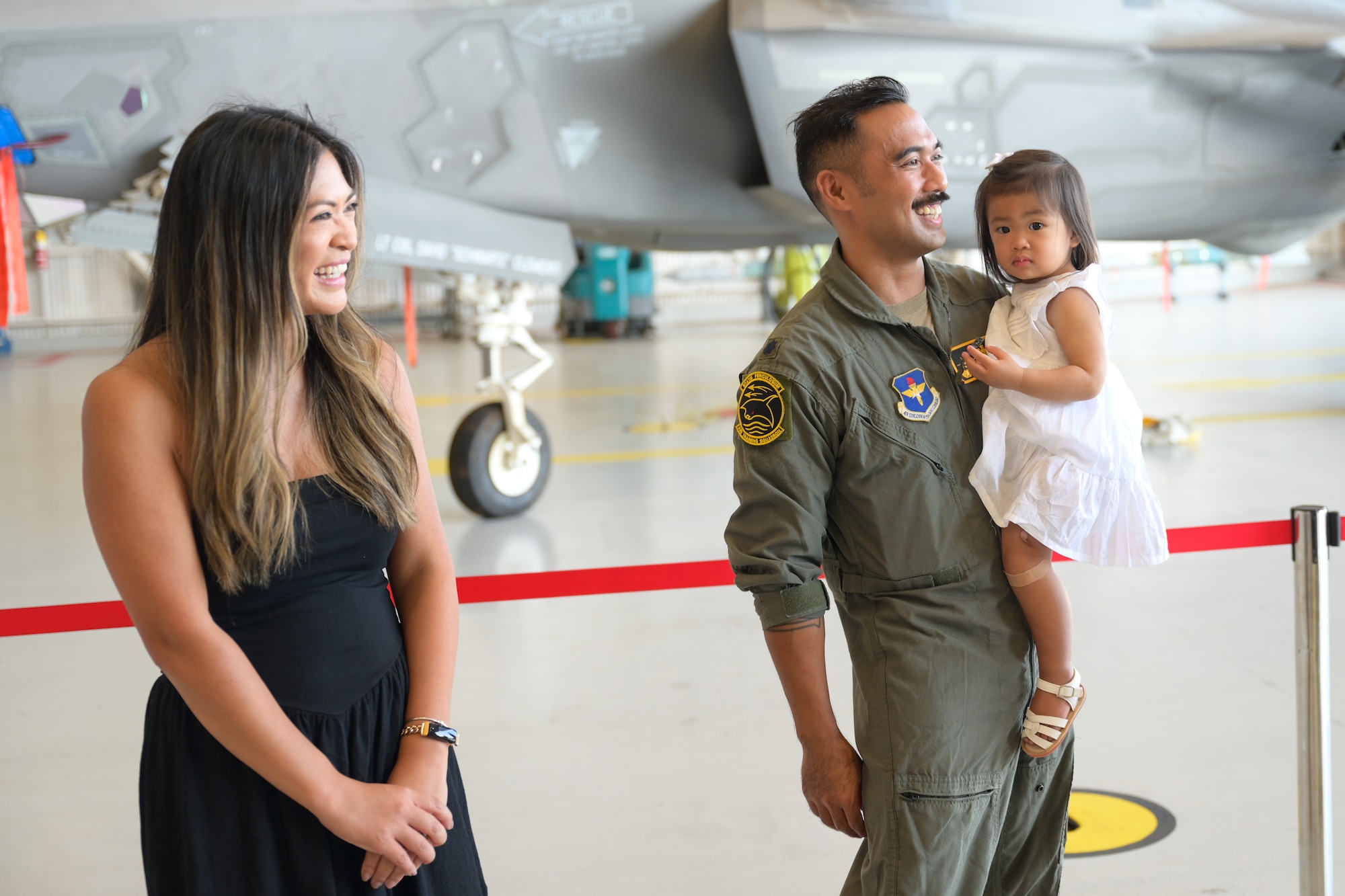 A photo of a family smiling.