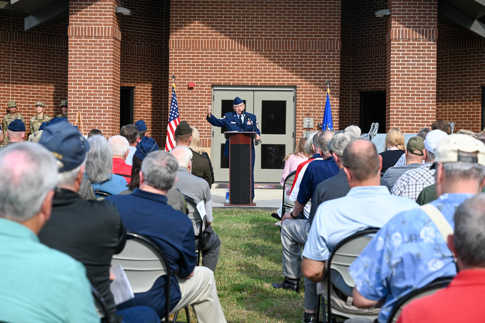 A retired service member gives a speech.