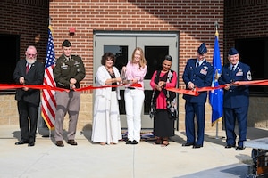 People cut a ribbon