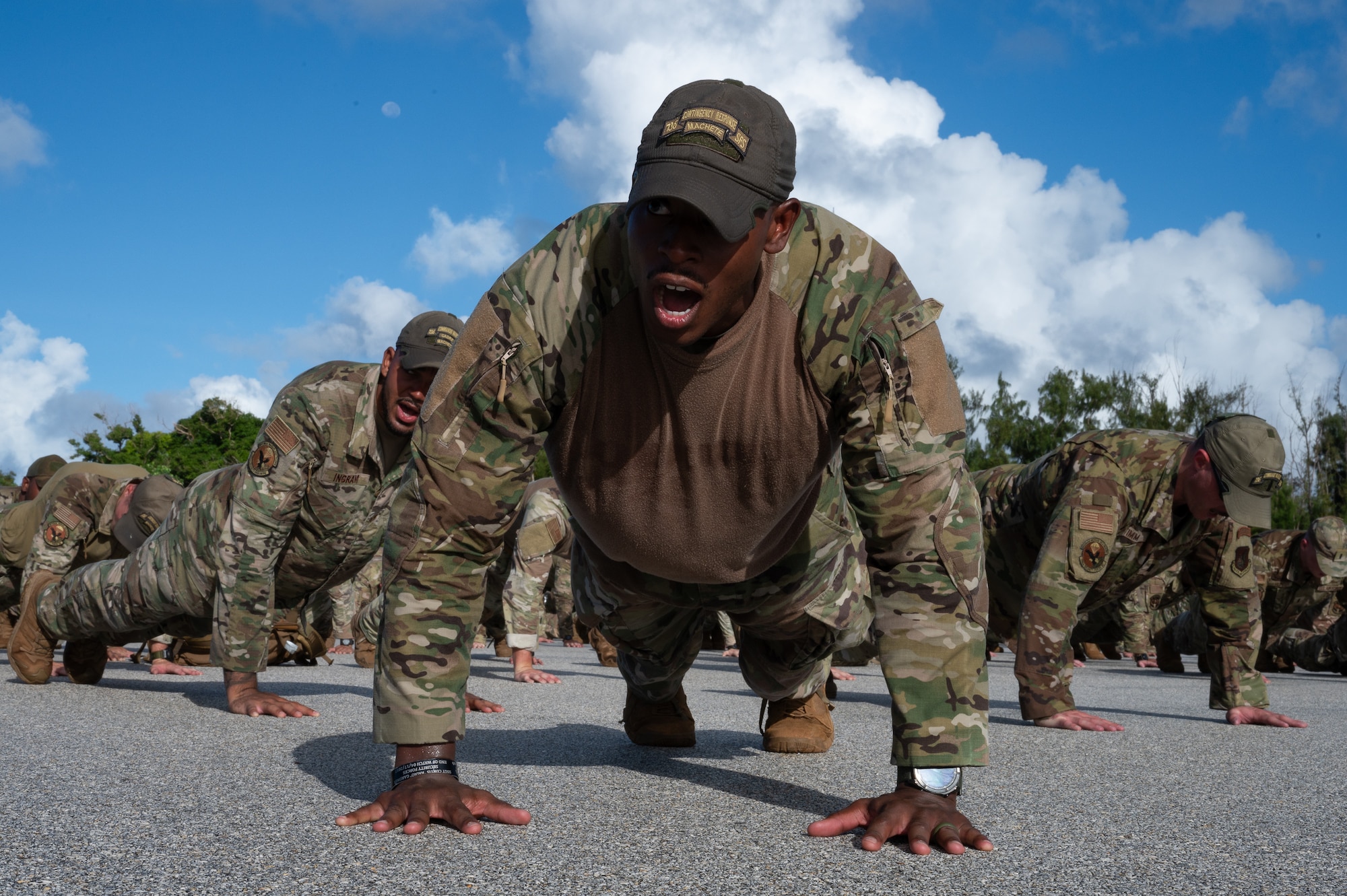 U.S. Air Force Master Sgt. Bryan Murphy, 736th Security Forces Squadron flight chief, performs memorial push-ups after a 9/11 Memorial Ruck at Andersen Air Force Base, Guam, Sept. 11, 2025.