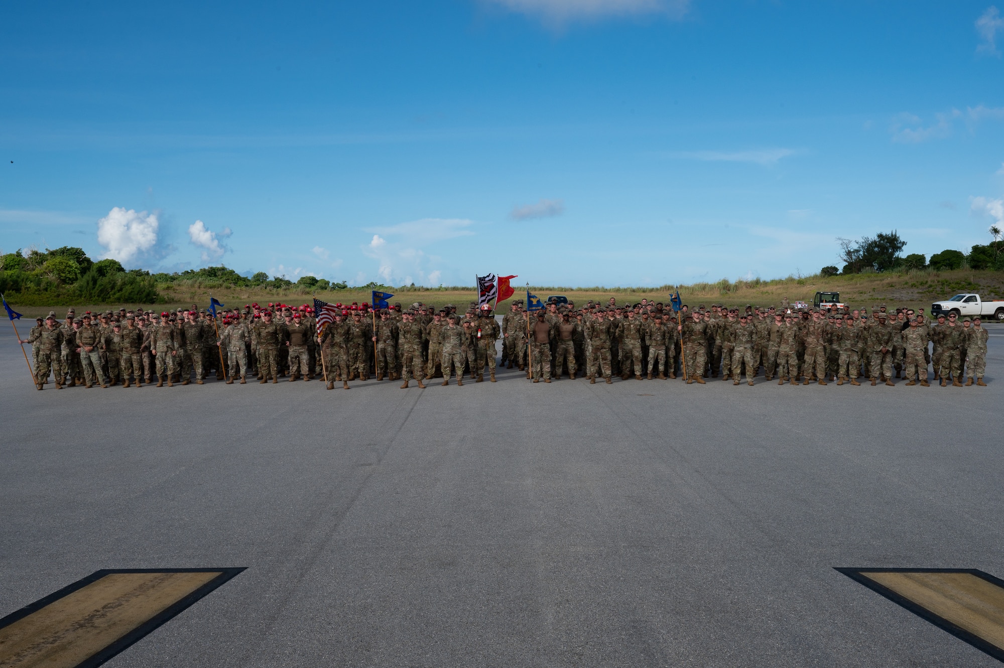 Service members pose for a group photo after a 9/11 Memorial Ruck at Andersen Air Force Base, Guam, Sept. 11, 2025.