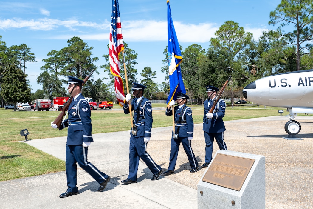 Honor guard airmen prepare to present colors.