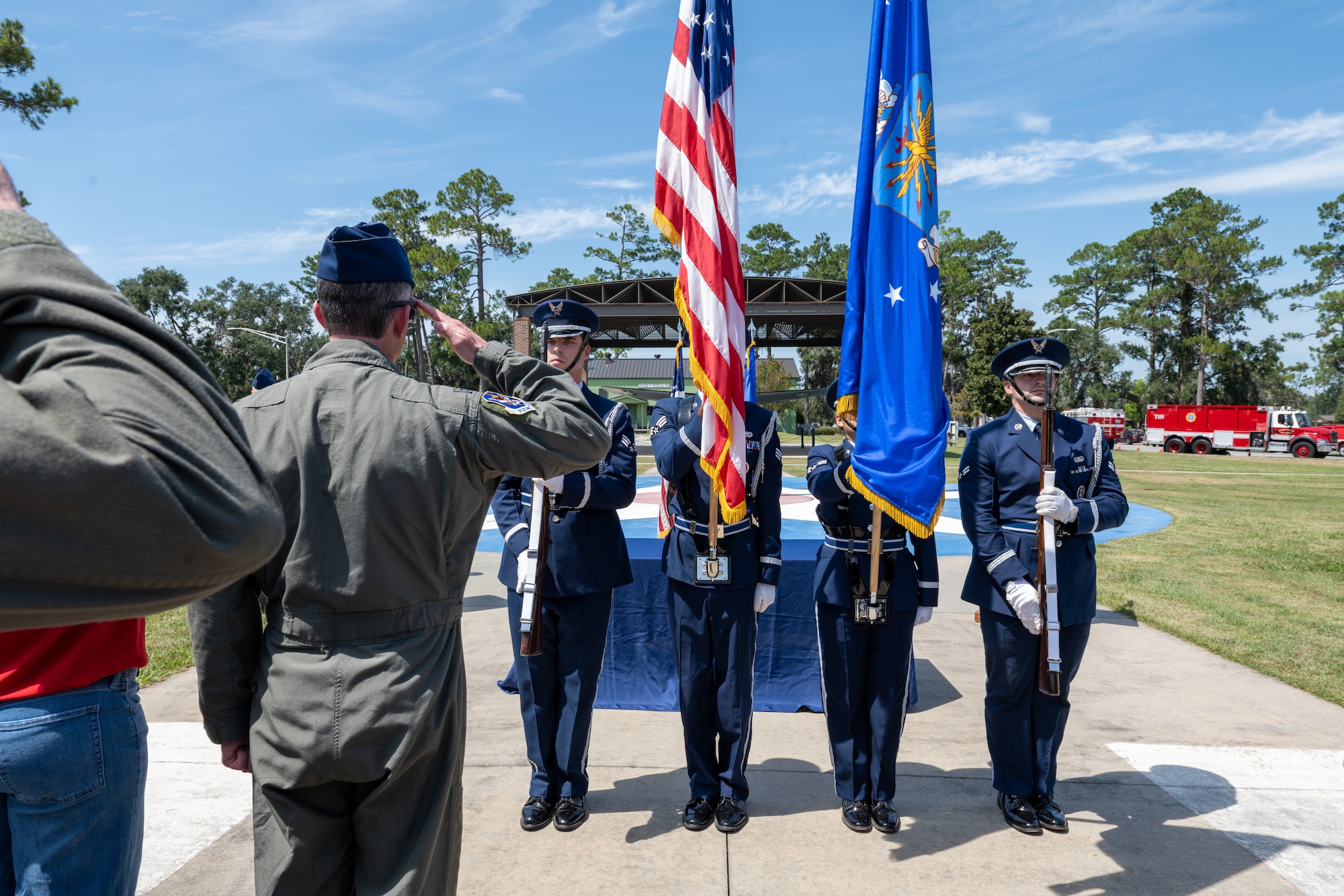 Honor guard airmen presents colors.