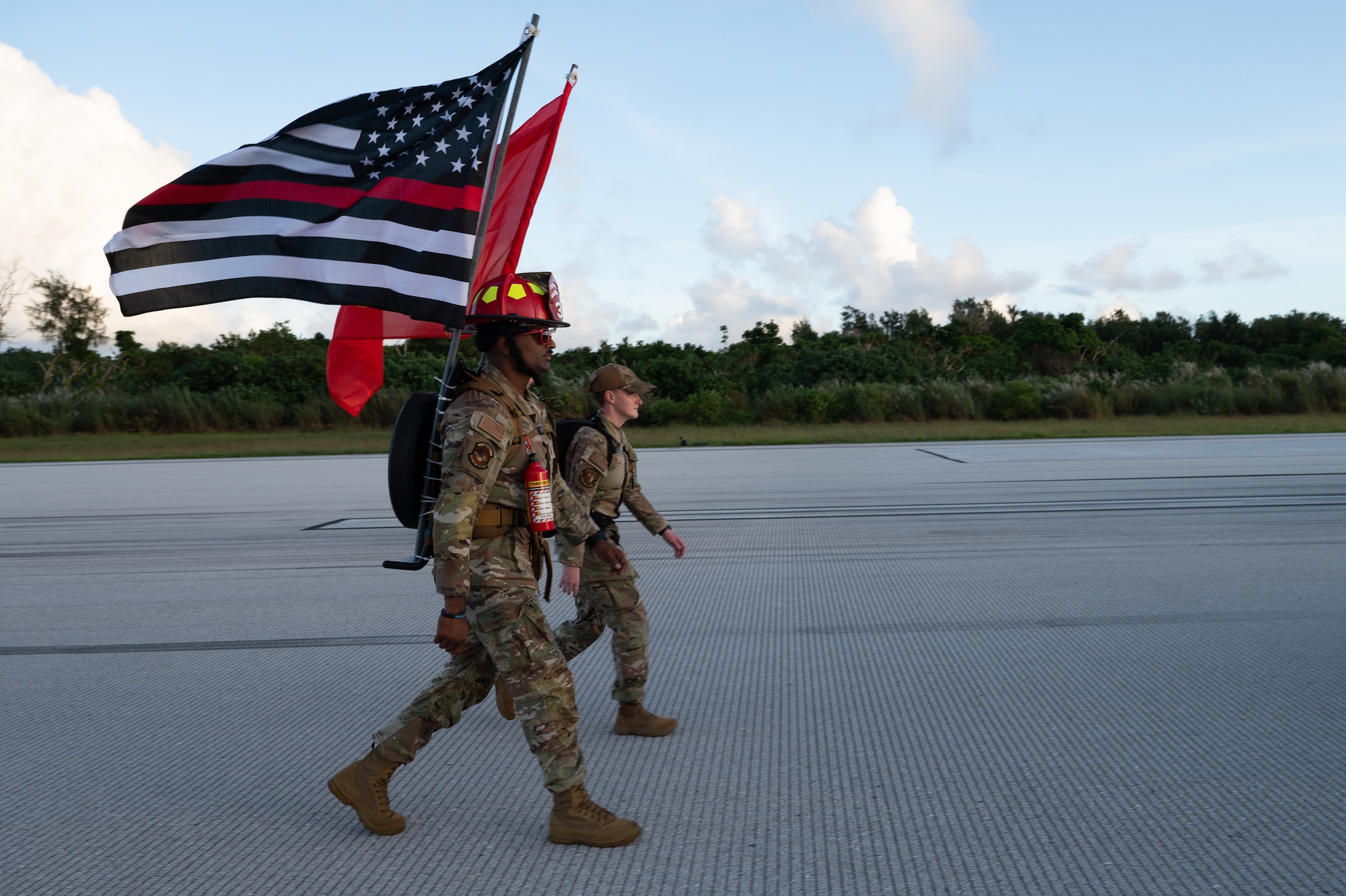 U.S. Air Force 2nd Lt. Bharat Kumar Peddu, ruck participant with the 166th Civil Engineer Squadron, Delaware Air National Guard, and Airman 1st Class Karly Jackson, 36th Civil Engineer Squadron water and fuel systems maintenance apprentice, participate in a 9/11 Memorial Ruck at Andersen Air Force Base, Guam, Sept. 11, 2025.