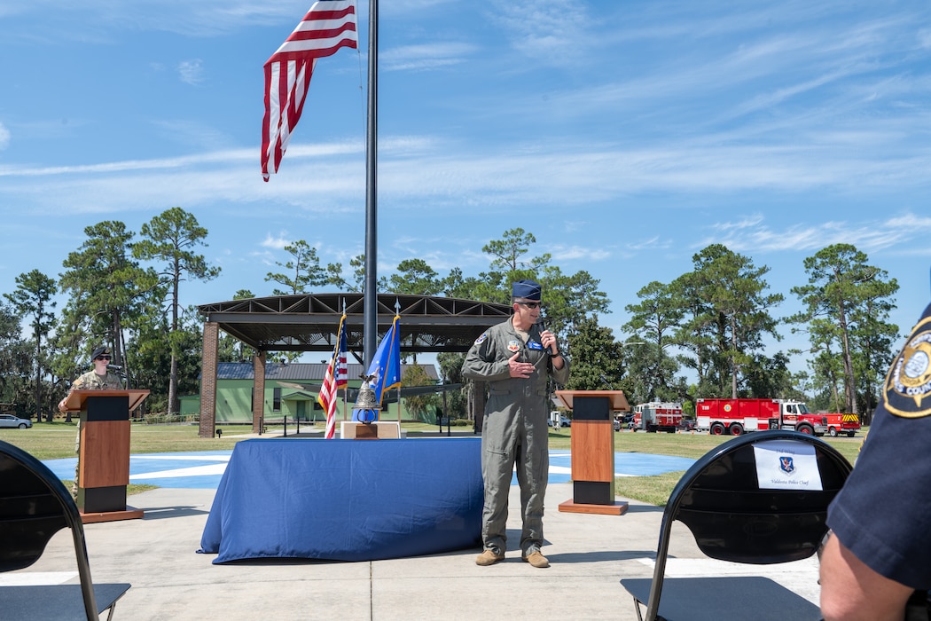 Speaker speaks to audience during 9/11 memorial.