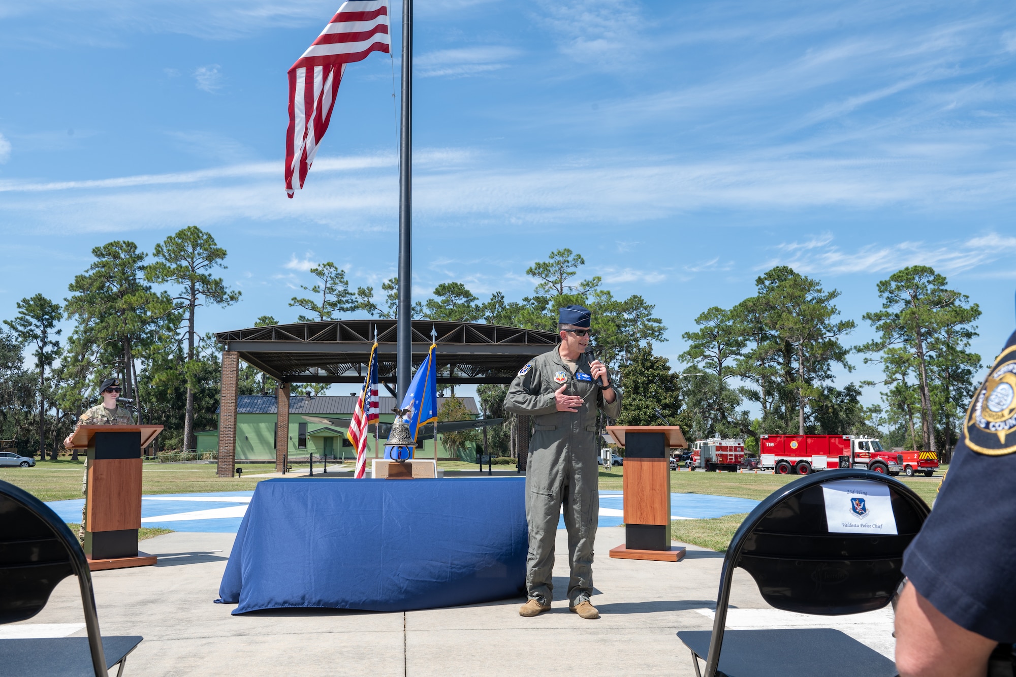 Speaker speaks to audience during 9/11 memorial.