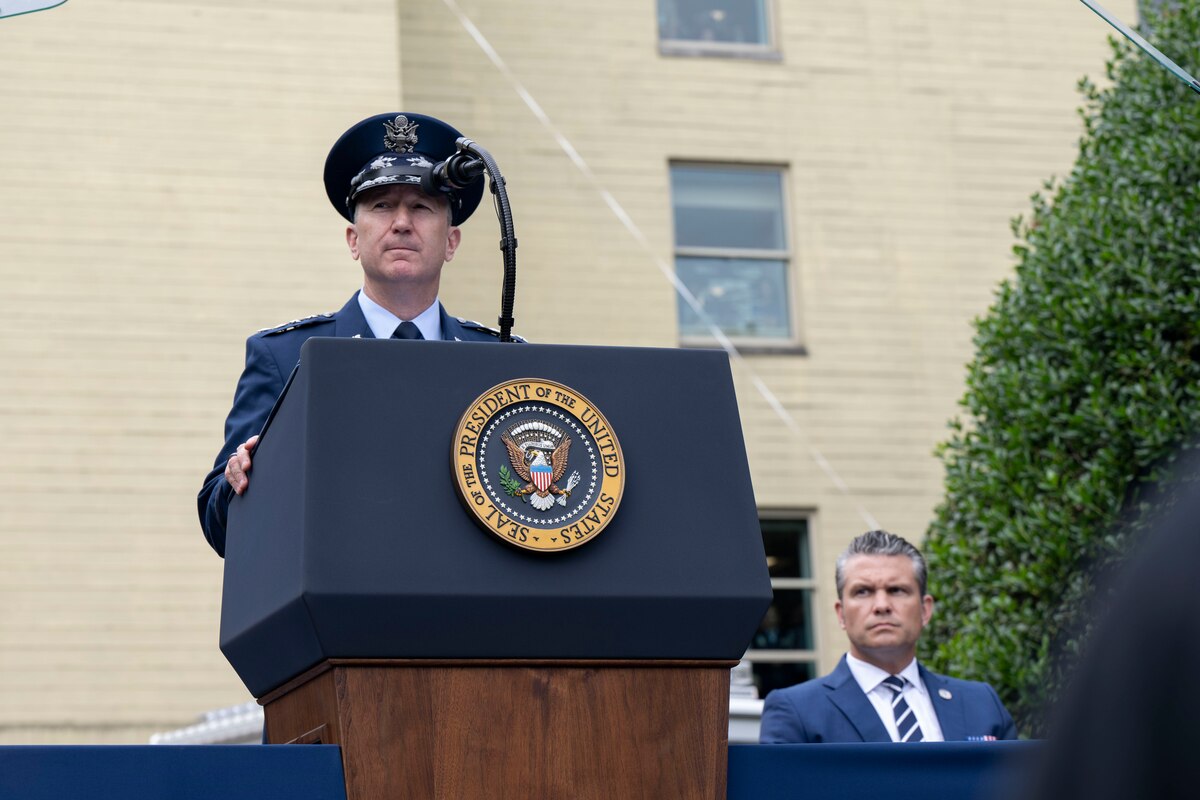The chairman speaks at a podium.