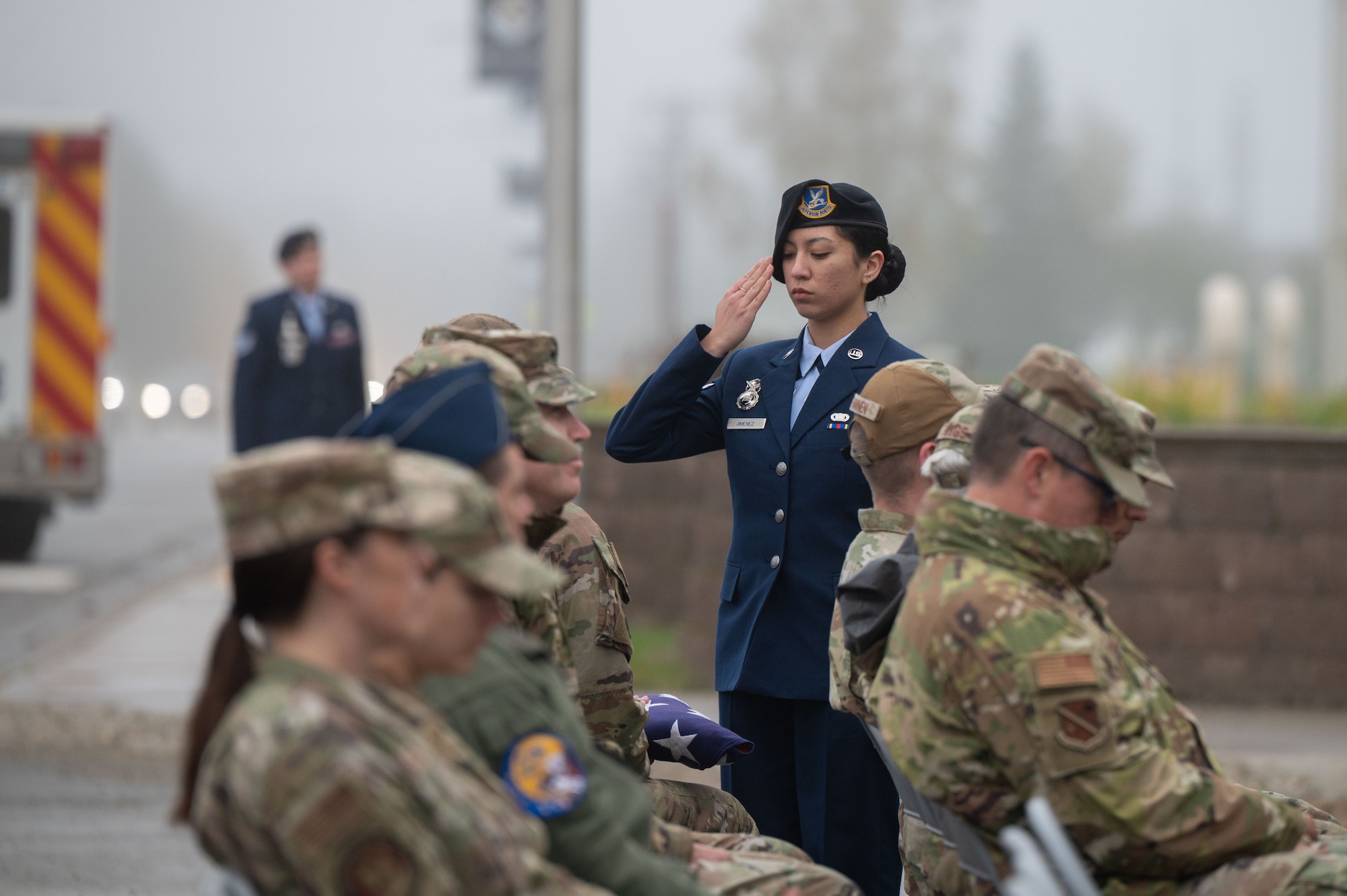 An Eielson Base Honor Guardsman salutes the American flag during a flag ceremony as part of the 24th annual 9/11 Remembrance Ceremony at Eielson Air Force Base, Alaska, Sept. 11, 2025.