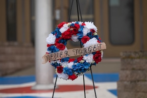 A wreath is presented during the 24th annual 9/11 Remembrance Ceremony at Eielson Air Force Base, Alaska, Sept. 11, 2025.