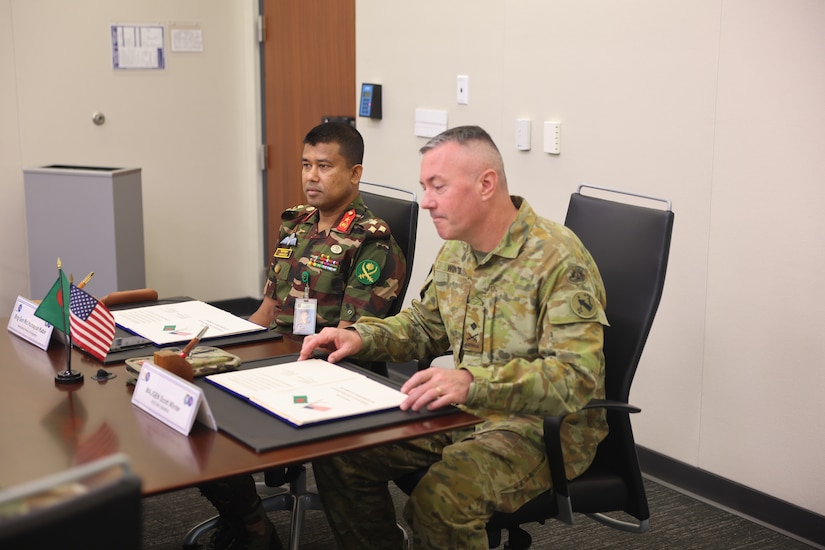 Maj. Gen. Scott A. Winter, U.S. Army Pacific Deputy Commander, -  Strategy and Plans, and Brig. Gen. Md Humayun Kabir, Director of the Military Training Directorate, signs the minutes from the Land Forces Talks at Fort Shafter, Hawaii, on Sept.  10, 2025.