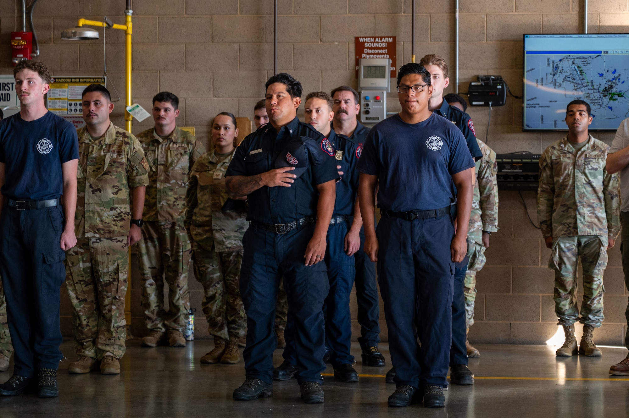 U.S. Airmen listen as a guest speaker shares remarks during a 9/11 Remembrance Event at Beale Air Force Base, California, Sept. 11, 2025. Beale hosted the event to honor the victims of the attacks and pay tribute to those who made the ultimate sacrifice. (U.S. Air Force photo by Airman 1st Class Chelsea Arana)