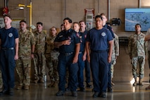 U.S. Airmen listen as a guest speaker shares remarks during a 9/11 Remembrance Event at Beale Air Force Base, California, Sept. 11, 2025. Beale hosted the event to honor the victims of the attacks and pay tribute to those who made the ultimate sacrifice. (U.S. Air Force photo by Airman 1st Class Chelsea Arana)