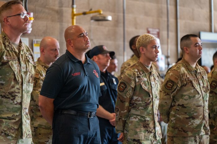 U.S. Airmen listen as a guest speaker shares remarks during a 9/11 Remembrance Event at Beale Air Force Base, California, Sept. 11, 2025. Beale hosted the event to honor the victims of the attacks and pay tribute to those who made the ultimate sacrifice. (U.S. Air Force photo by Airman 1st Class Chelsea Arana)