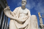 Statues of Greek historian Polybius and Goddess Athena in front of Parliament building in Austria, Vienna