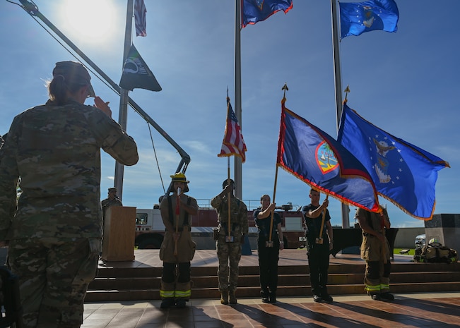 A honor guard consisting the Guam Police Department, 36th Civil Engineer Squadron firefighters and a 36th Security Forces Squadron patrolman, present the colors during a Patriot Day Remembrance Ceremony on Andersen Air Force Base, Guam, Sept. 11, 2025.