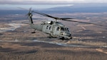 An Alaska Air National Guard HH-60G Pave Hawk helicopter assigned to the 210th Rescue Squadron flies over Joint Base Elmendorf-Richardson, Alaska while conducting a training operation Oct. 2, 2024. The Pave Hawk is the 176th Wing’s primary platform for personnel extraction since the all-weather helicopter can land in a variety of austere locations, and the crew can employ the rescue hoist when landing is not possible. The 210th, along with the 211th and 212th RQSs, make up the 176th Wing Rescue Triad and are among the busiest combat search and rescue units in the world. (Alaska National Guard photo by Alejandro Peña)