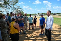 Col. Joshua Garrison, right, 960th Cyberspace Wing commander, addresses Airmen before a 5K run at the Medina Chapman Fitness Center on Joint Base San Antonio-Lackland, Texas Sep. 2, 2025.