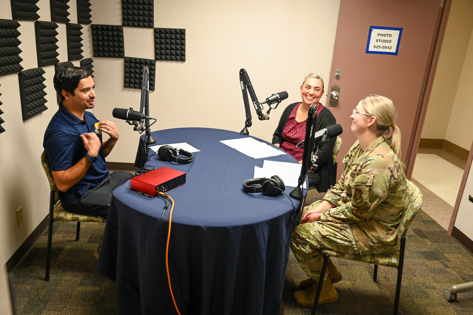 Frances Martinez, center, 960th Cyberspace Wing director of psychological health, Chaplain (Maj.) Heather Mendoza, 433rd Airlift Wing deputy wing chaplain, and Julian Hernandez, 433rd Airlift Wing public affairs specialist, discuss suicide awareness during an episode of the “Ready, Set, Airlift!” podcast at Joint Base San Antonio-Lackland, Texas Sep. 3, 2025.