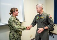 OKINAWA, Japan (Sept. 10, 2025) Adm. Steve Koehler, commander, U.S. Pacific Fleet, presents a challenge coin to Information Systems Technician 2nd Class Emma Gleghorn during his visit to Commander, Task Force (CTF) 76 on White Beach Naval Facility, Okinawa, Sept. 10. Koehler’s visit to Okinawa underscored the Pacific Fleet’s commitment to integrated maritime operations alongside the U.S. Marine Corps and highlighted ongoing efforts to strengthen forward-deployed readiness, joint force interoperability, and regional partnerships in support of a free and open Indo-Pacific. Within the U.S. 7th Fleet area of operations, CTF 76 is responsible for conducting expeditionary warfare operations with Navy and Marine Corps capabilities to support theater contingencies that range from crisis response to full combat operations. (U.S. Navy photo by Mass Communication Specialist 1st Class Chase Stephens)