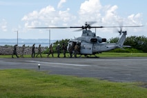 OKINAWA, Japan (Sept. 10, 2025) Adm. Steve Koehler, commander, U.S. Pacific Fleet; Lt. Gen. Roger Turner, commanding general of III Marine Expeditionary Force; Rear Adm. Tom Shultz, commander, Task Force (CTF) 76; Air Force Brig. Gen. John Gallemore, commander 18th Wing, Kadena Air Base, Japan; and members of their respective staffs board a Marine Corps UH-1Y Venom helicopter, attached to Marine Light Attack Helicopter Squadron 169, during Koehler’s visit to (CTF) 76 on White Beach Naval Facility, Okinawa, Sept. 10. Koehler’s visit to Okinawa underscored the Pacific Fleet’s commitment to integrated maritime operations alongside the U.S. Marine Corps and highlighted ongoing efforts to strengthen forward-deployed readiness, joint force interoperability, and regional partnerships in support of a free and open Indo-Pacific. Within the U.S. 7th Fleet area of operations, CTF 76 is responsible for conducting expeditionary warfare operations with Navy and Marine Corps capabilities to support theater contingencies that range from crisis response to full combat operations. (U.S. Navy photo by Mass Communication Specialist 2nd Class Danilo Reynoso)