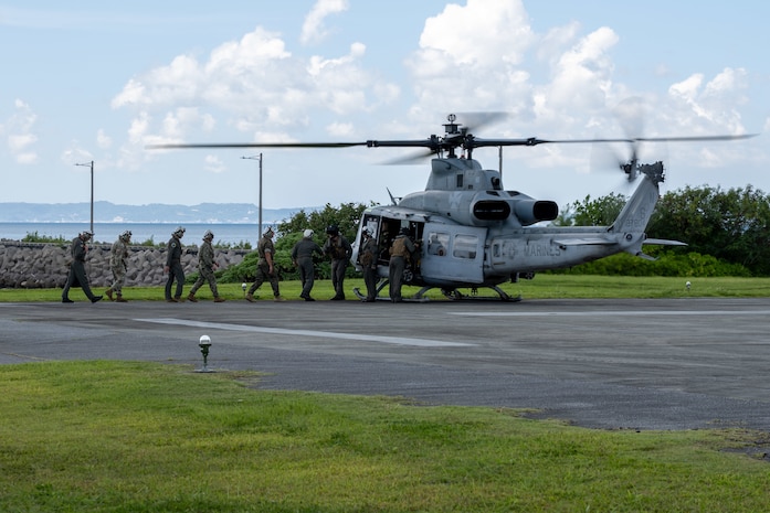 OKINAWA, Japan (Sept. 10, 2025) Adm. Steve Koehler, commander, U.S. Pacific Fleet; Lt. Gen. Roger Turner, commanding general of III Marine Expeditionary Force; Rear Adm. Tom Shultz, commander, Task Force (CTF) 76; Air Force Brig. Gen. John Gallemore, commander 18th Wing, Kadena Air Base, Japan; and members of their respective staffs board a Marine Corps UH-1Y Venom helicopter, attached to Marine Light Attack Helicopter Squadron 169, during Koehler’s visit to (CTF) 76 on White Beach Naval Facility, Okinawa, Sept. 10. Koehler’s visit to Okinawa underscored the Pacific Fleet’s commitment to integrated maritime operations alongside the U.S. Marine Corps and highlighted ongoing efforts to strengthen forward-deployed readiness, joint force interoperability, and regional partnerships in support of a free and open Indo-Pacific. Within the U.S. 7th Fleet area of operations, CTF 76 is responsible for conducting expeditionary warfare operations with Navy and Marine Corps capabilities to support theater contingencies that range from crisis response to full combat operations. (U.S. Navy photo by Mass Communication Specialist 2nd Class Danilo Reynoso)