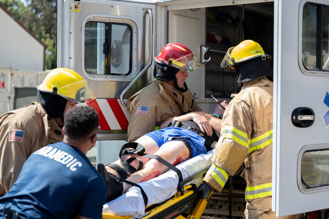 39th Air Base Wing emergency responders, transport a casualty into an ambulance during Exercise Titan Shield 25-09 at Incirlik Air Base, Türkiye, Sept. 10, 2025. The mass casualty portion of the exercise tested Airmen’s ability to deliver fast, coordinated care under pressure, demonstrating their readiness to support the mission during crisis conditions. (U.S. Air Force photo by Senior Airman Greydon Furstenau)