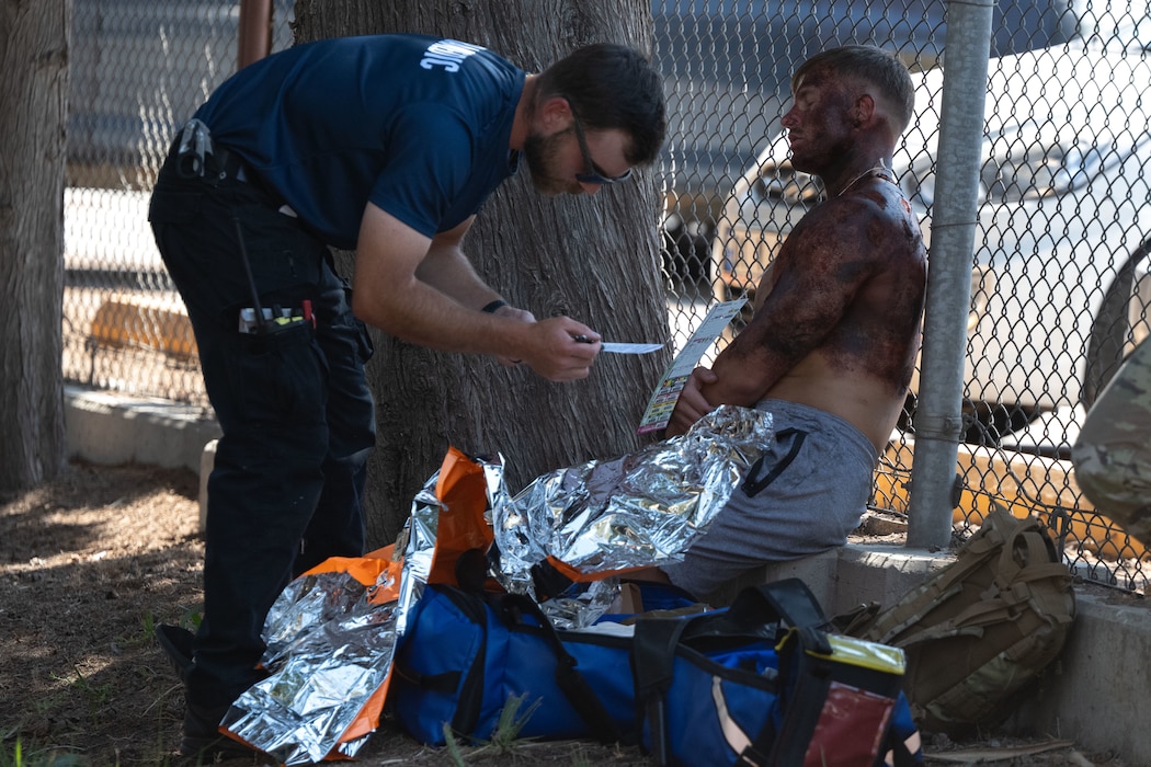U.S. Air Force Senior Airman Joshua Brinegar, 39th Medical Group paramedic, renders aid to casualties during Exercise Titan Shield 25-09 at Incirlik Air Base, Türkiye, Sept. 10, 2025. The mass casualty portion of the exercise tested Airmen’s ability to deliver fast, coordinated care under pressure, demonstrating their readiness to support the mission during crisis conditions. (U.S. Air Force photo by Senior Airman Greydon Furstenau)
