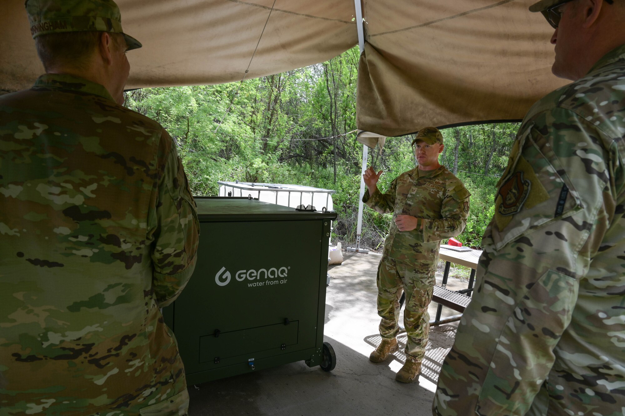 Airman briefing the use of a water generator.