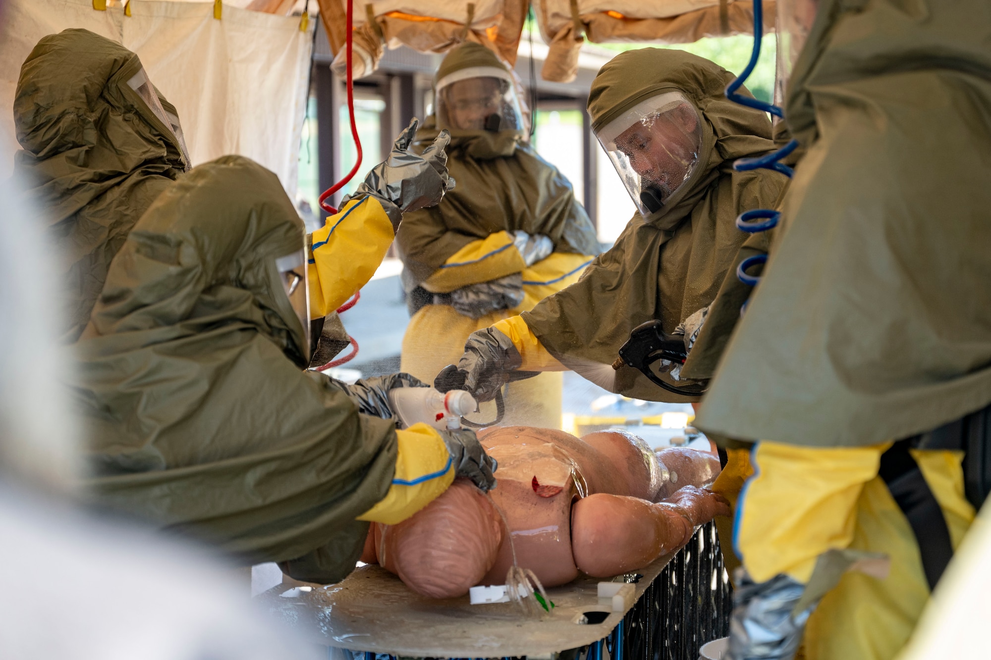 U.S. Air Force Airmen assigned to the 51st Medical Group process a simulated casualty through a decontamination line at Osan Air Base, Republic of Korea, Sept. 11, 2025.